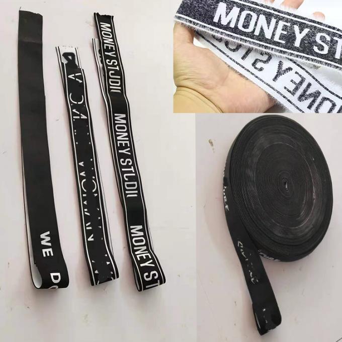 MOQ bajo modificó el logotipo blanco del telar jacquar para requisitos particulares para la goma del pelo del abrigo elástico negro de la cabeza